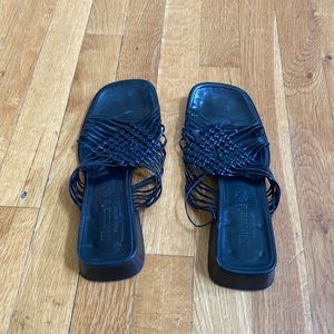 Black woven low heeled sandals